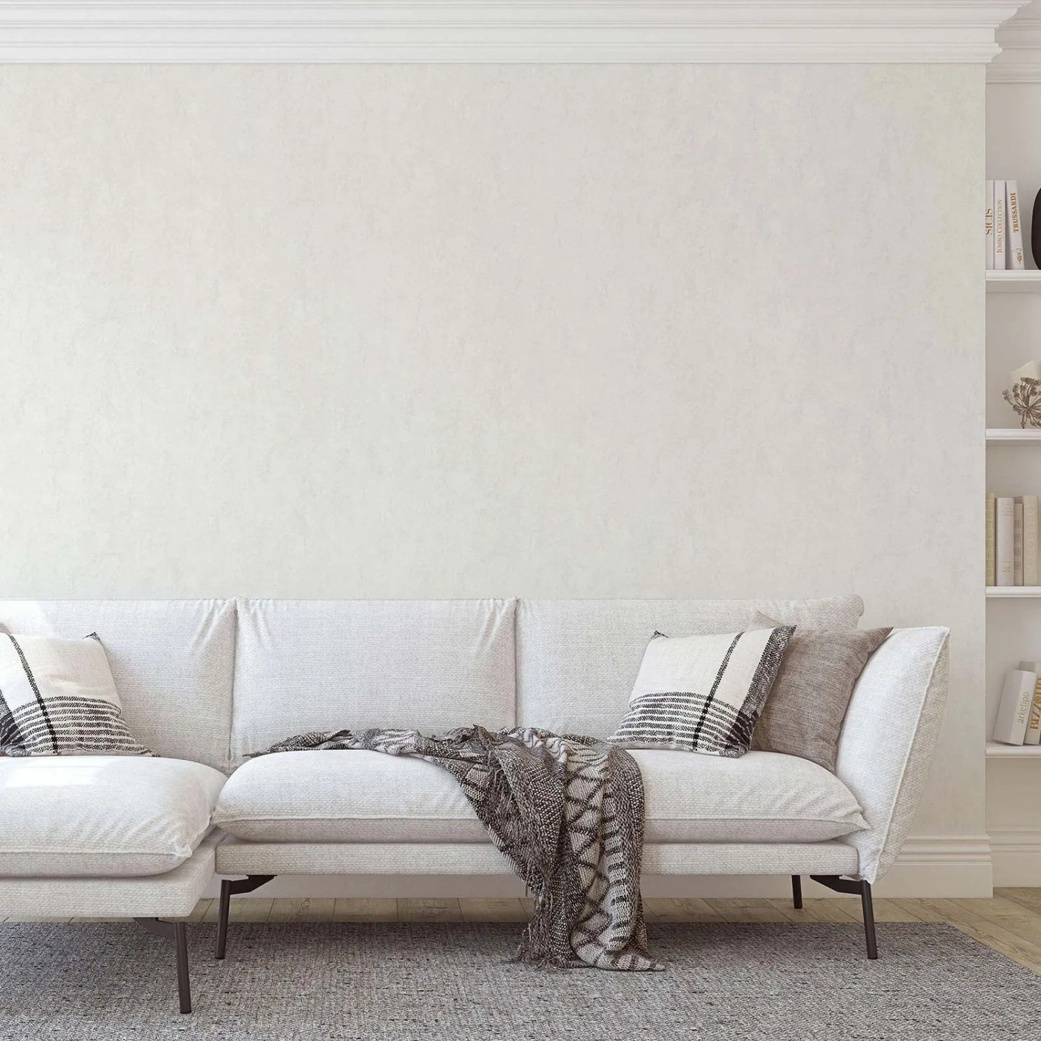 Helle Wohnraum-Szene mit weißer Bricoflor Guido Maria Tapete an der Wand.