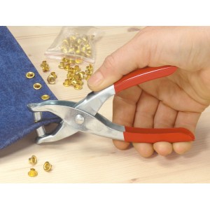 Ellix Ösenzange 140mm mit 100 Ösen in Aktion, zum Anbringen von Ösen in Stoff.