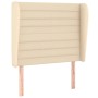 Cremefarbenes Boxspringbett mit Stoffbezug und Kopfteil, 100x200 cm.