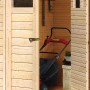 Offenes Karibu Holz-Gartenhaus Östersund mit Rasenmäher und Gartengeräten.