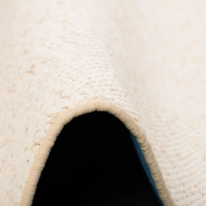 Detailansicht Kurzflorteppich Juna meliert beige in Woll-Optik, 100x100cm.