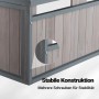 Detail der stabilen Konstruktion der grauen Mähroboter Holzgarage aus Tannenholz mit sichtbaren Schrauben.