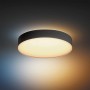 Schwarze, runde Philips Hue Deckenleuchte Enrave L mit warmweissem Licht und Dimmer.