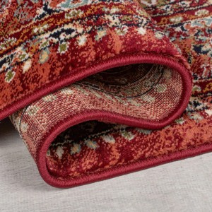 Gerollter roter Vintageteppich Sandford mit detailreichem, meliertem Muster. Strapazierfähig für Wohn- & Schlafzimmer.