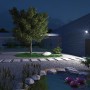 Angestrahlter Garten mit Steinel LED-Strahler XLED one in Anthrazit an Hauswand.