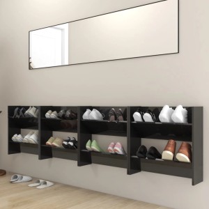 Vier hochglanz-schwarze Wand-Schuhschränke (60x18x60 cm) mit Schuhen an einer Wand unter einem Spiegel.
