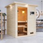 Woodfeeling Sauna Sandra mit Ofen und LED-Dachkranz im Badezimmer.