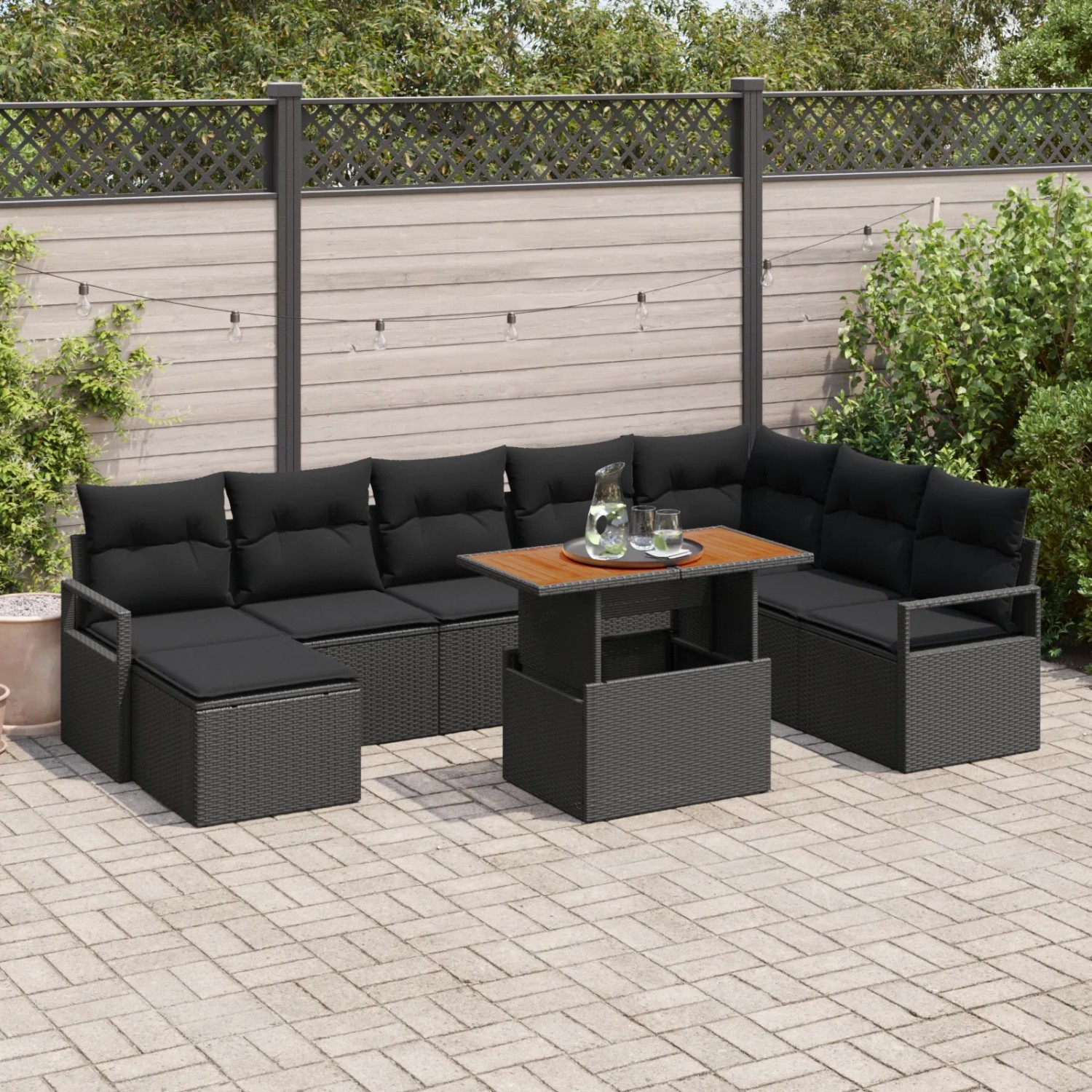 Schwarzes 9-teiliges vidaXL Garten-Sofa Set aus Rattan mit Kissen.