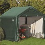 Grüne ShelterLogic Zeltgarage 180x180x180cm mit Gartengeräten im Garten.