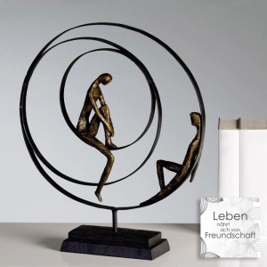 Gilde Skulptur Patience: Zwei bronzefarbene Figuren in schwarzen Ringen auf Sockel, 41 cm. Mit Spruchkarte.