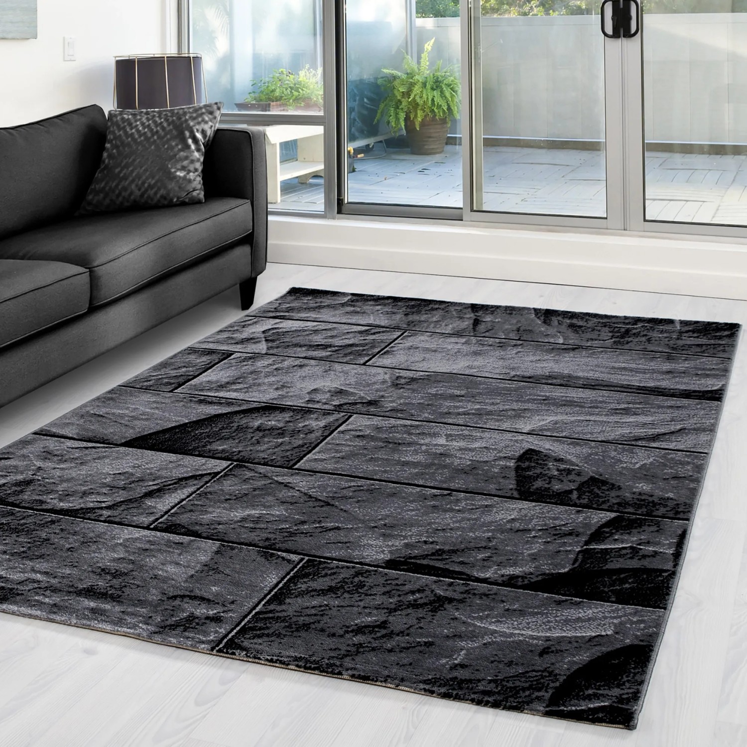 Ayyildiz Kurzflorteppich Parma, 160x230 cm, schwarz mit Steinmuster im Wohnzimmer.