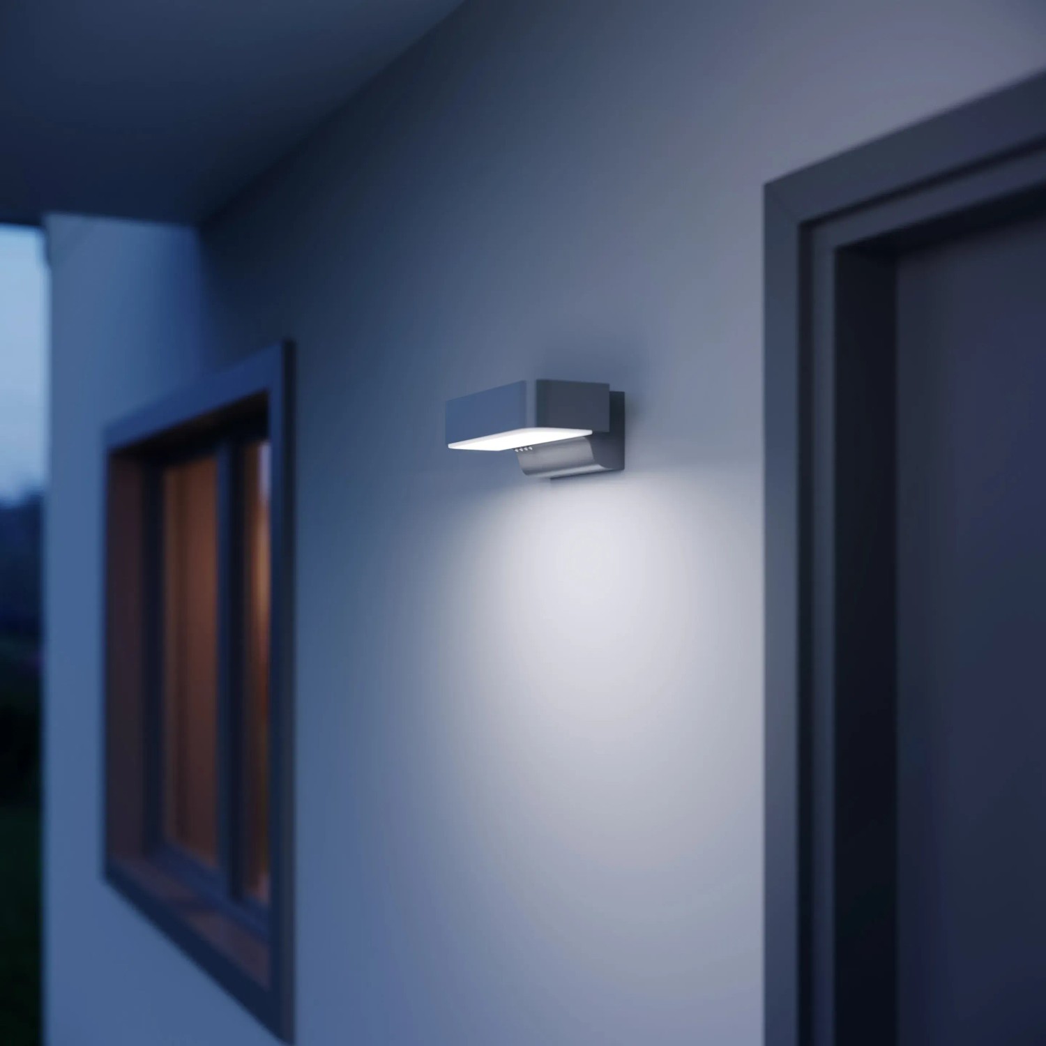 Moderne Steinel LED-Außenleuchte L 800 SC mit Bewegungsmelder in Anthrazit an Hauswand.