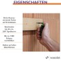 Hand nutzt Pica Powder Bohrloch-Spraymarker Set für präzise Markierung an Holzbrett auf Ziegelwand. Grünes Pulver, 360° Sprüharm, nachfüllbar.