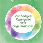 Grüne Kommunion Duftkerze im Glas mit Kokosduft und Regenbogen-Design.