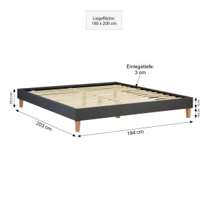 Graues Polsterbett 180x200 cm mit Lattenrost und Holzfüßen. Bett ohne Kopfteil im Futonstil.