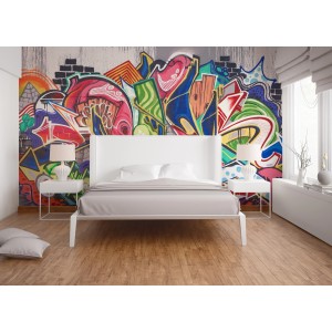 Fototapete mit buntem Graffiti-Motiv in Grau, Grün, Rot, Orange und Blau im Schlafzimmer.