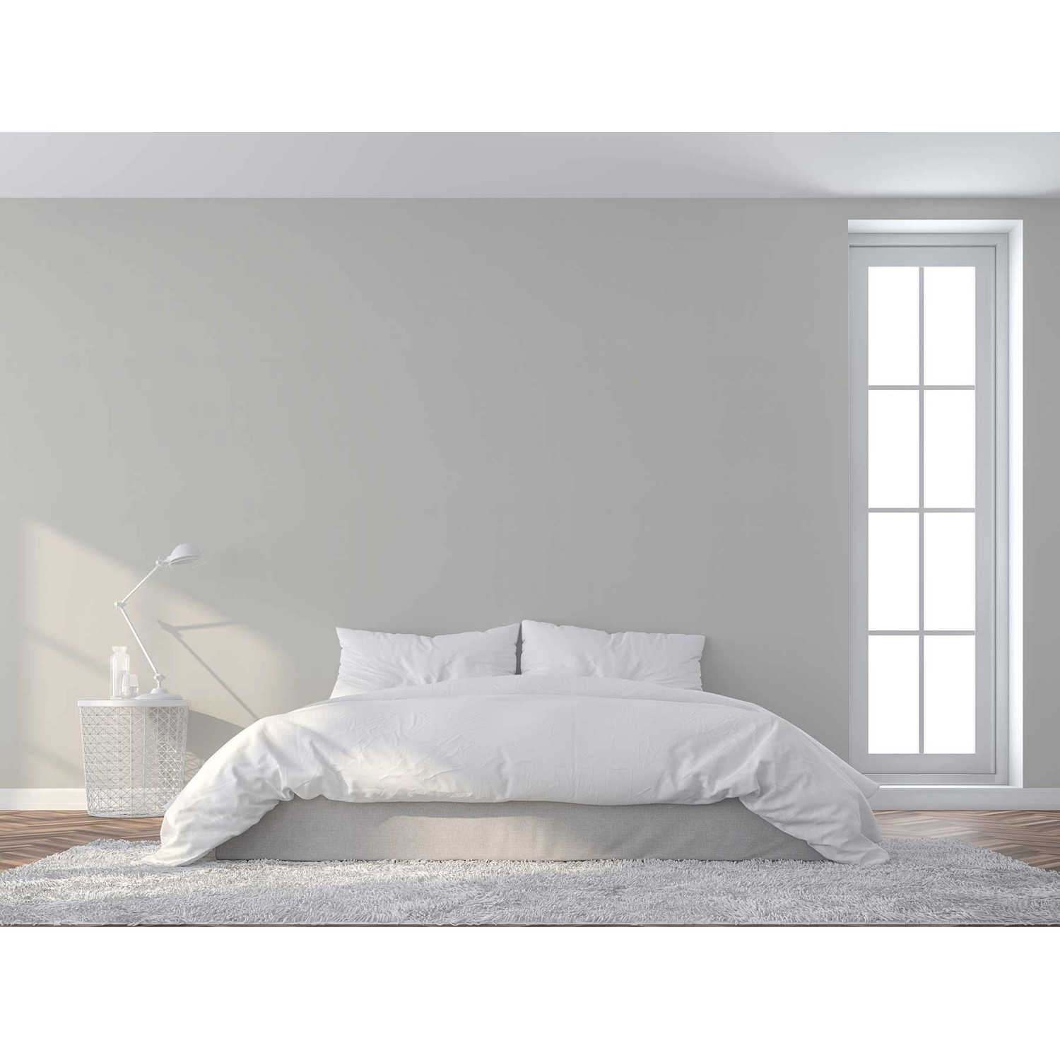 Helles Schlafzimmer mit weißer Tadessi Vliestapete Uni und Bett.