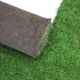 Foto von Premium Rollrasen (30-39 m²). Rolle und verlegte Fläche mit saftigem Grün.