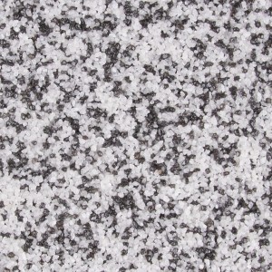 Nahaufnahme von Terralith Buntsteinputz in Weiß-Schwarz, feine 2mm Körnung. Dekorativer Mosaikputz für Wände.