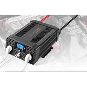 Schwarzer Technaxx Wechselrichter 2000W TE20 für Autoelektrik mit 2 Steckdosen und USB-Anschlüssen.