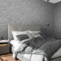 Marburg Vliestapete in Steinoptik (weißgrau) im Schlafzimmer.