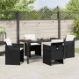 Schwarze 5-tlg. vidaXL Garten Essgruppe aus Poly Rattan mit Tisch und Stühlen inklusive Kissen.