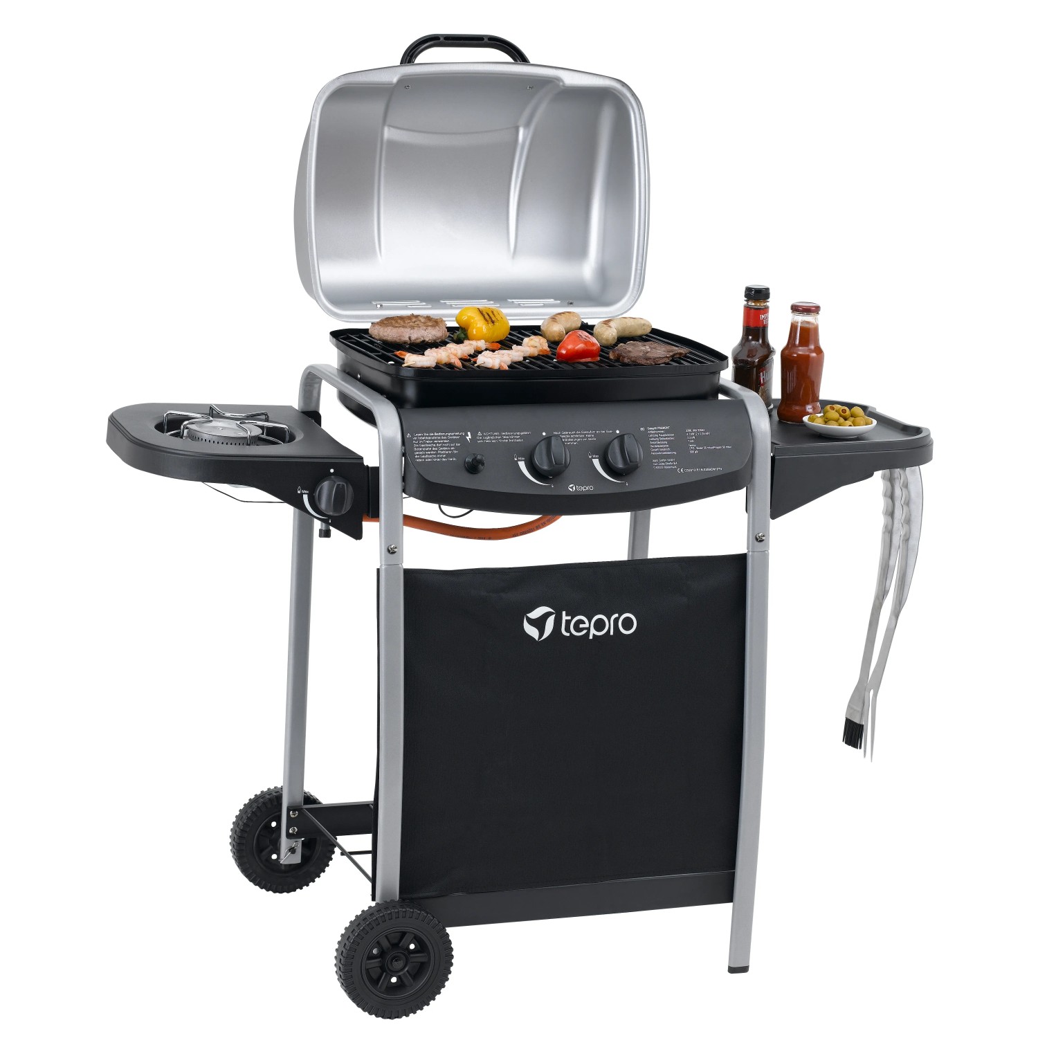 Tepro Gasgrill Fremont, schwarz/silber, mit Seitenkochfeld und Grillgut auf dem Rost.