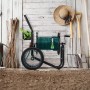 Schwarzer Relaxdays Schlauchwagen aus Stahl mit grüner Schlauchtrommel, Handkurbel, Rädern und Korb für Gartenschläuche.