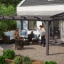 Freistehende Skan Holz Terrassenüberdachung Sanremo in Schiefergrau mit Sitzgruppe.