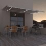 Cremefarbene vidaXL Markise mit LED-Beleuchtung und weißem Rahmen überdacht Terrasse.