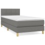 Dunkelgraues Boxspringbett 80x200 cm mit Matratze und Kopfteil. Stoffbezug und helle Holzfüße.