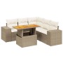 Beige 6-teilige Garten-Sofagarnitur aus Rattan mit Tisch und Kissen.