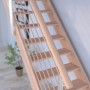 Helle Holztreppe Mykonos Pro mit Design-Geländer und Holzstäben, gewendelt, aus Buche (FSC®)