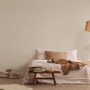 A.S. Création Vliestapete Uni Beige im Schlafzimmer, schlichte Wandgestaltung.