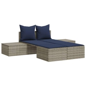 Graue Doppel-Sonnenliege aus Rattan mit blauen Kissen. Entspannung pur im Garten!