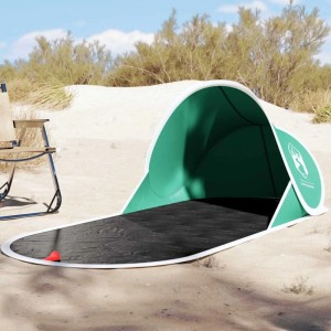 Meergrünes Furnicato Pop Up Strandzelt auf Sandstrand. Schneller Aufbau, idealer Sonnenschutz für Camping & Zubehör.
