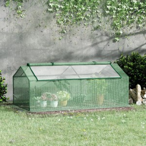 Grünes Furnicato Foliegewächshaus 180x90x70 cm im Garten, mit Pflanzen.