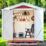 Schlauchtrommel von Relaxdays im Gartenschuppen, mit Gartengeräten und Blumentöpfen.