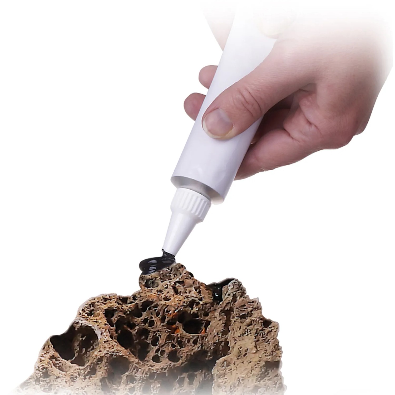 Anwendung von JBL ProHaru Universalkleber auf Aquariendeko. 80 ml Tube für Aquarien, Terrarien und Teiche.