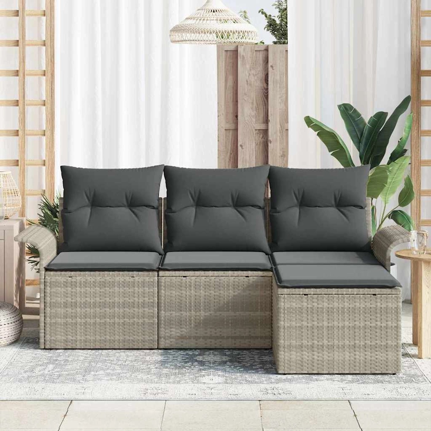 Hellgraues 4-teiliges vidaXL Garten-Sofa-Set aus Poly Rattan mit Kissen.