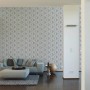 Wohnraum mit A.S. Creation Vliestapete Move your Wall Grafik in Grau mit 3D-Effekt.