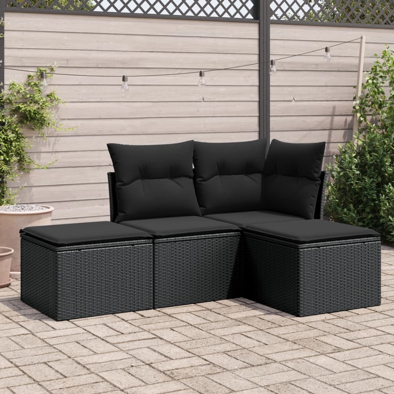 Schwarze 4-tlg. vidaXL Garten-Sofagarnitur aus Poly Rattan mit Kissen.