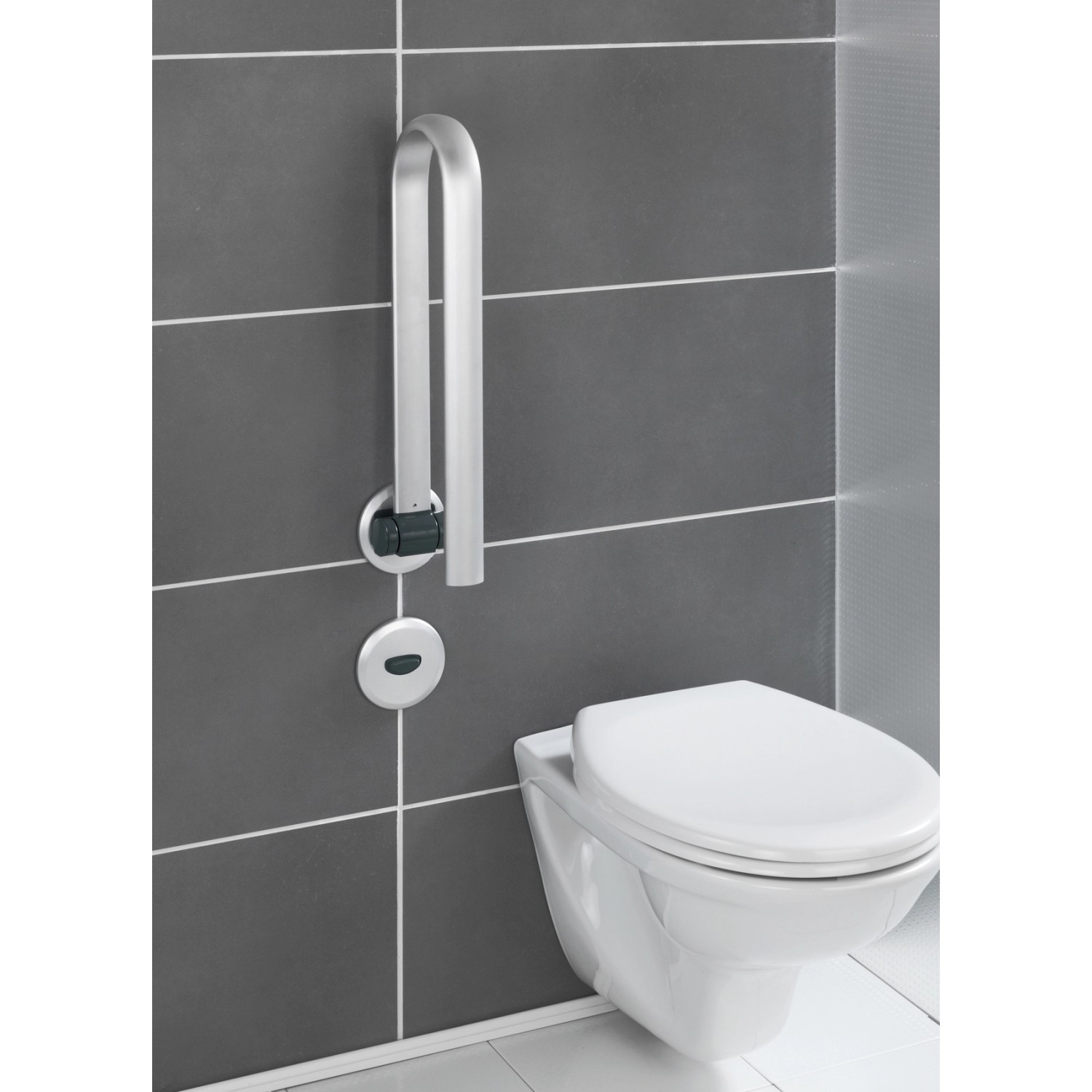Wenko klappbarer Badstützgriff Secura Premium aus Aluminium neben einem WC an grauer Wand.