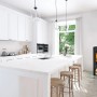 Schwarzer Fireplace Tuvalu Kaminofen (6 kW) im modernen Wohnraum.