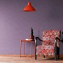 Guido Maria Kretschmer Vliestapete Fusion, violett, an Wand im Wohnraum.