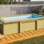 Karibu Holzpool Triton, kesseldruckimprägniert, mit Pooldeck und Leiter im Garten.