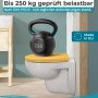 Curry-gelber WC-Sitz auf Toilette mit 250 kg Hantel, demonstriert hohe Belastbarkeit.