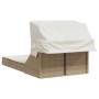 Beige Doppel-Sonnenliege mit Dach und Auflagen aus Poly Rattan.
