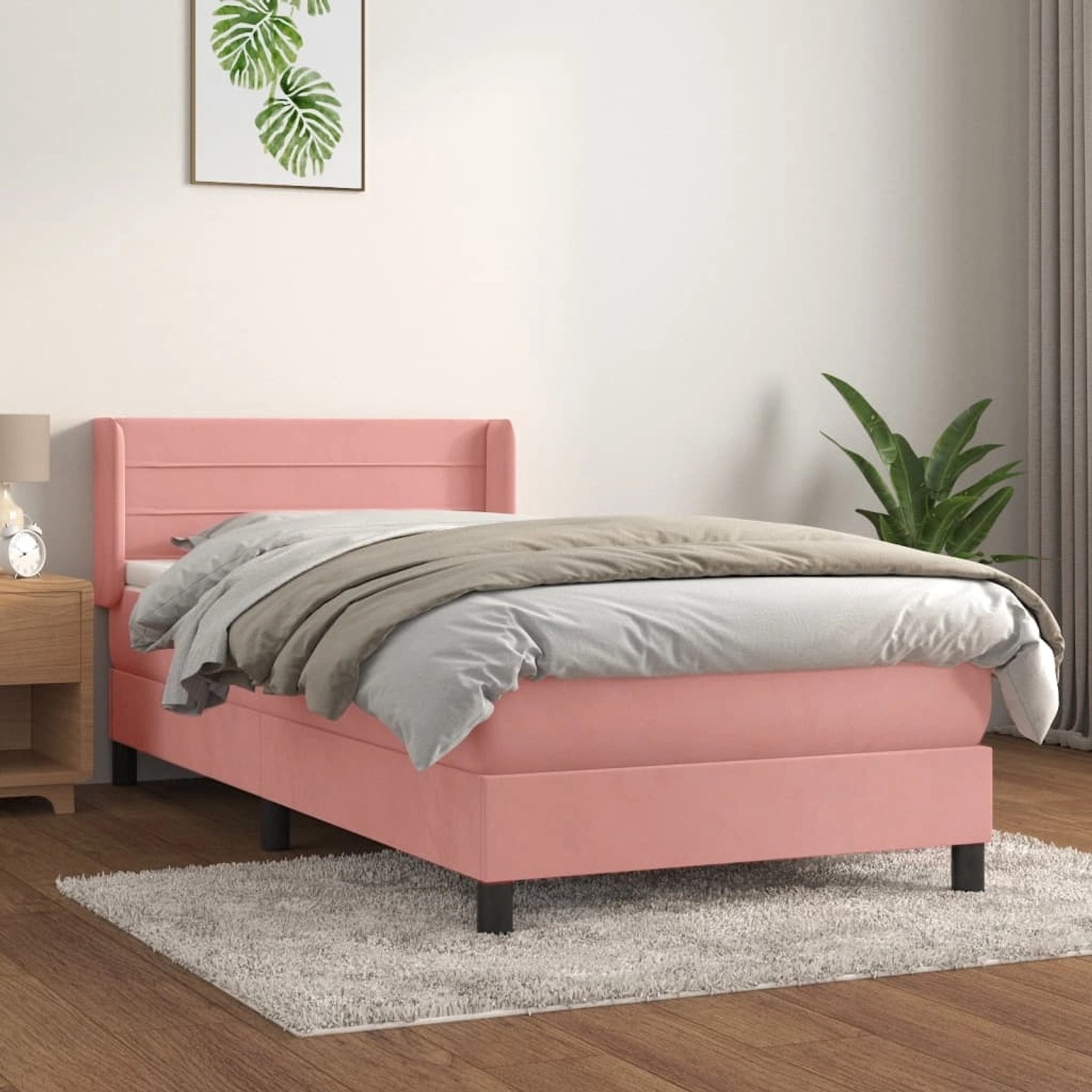 Rosa Boxspringbett mit Matratze (90x200 cm) aus Samt. Bett mit Kopfteil und Matratzenauflage.