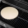 Rösle Pizzastein Vario Ø 30 cm aus Schamott auf einem Grillrost. Ideal für knusprige Pizza.